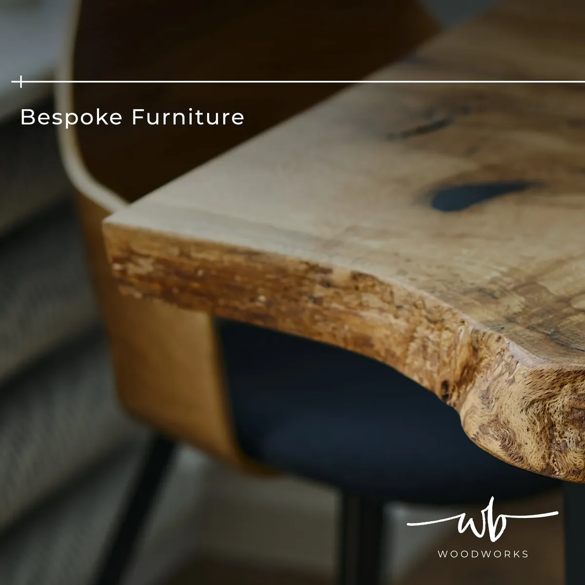 Close-up of a bespoke solid wood table showing its natural live edge and knot detail