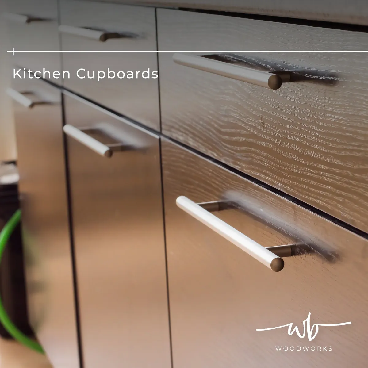 Custom kitchen cupboards with textured oak-grain doors and slim bar handles in Bloemfontein